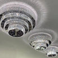 https://cdn.shopify.com/s/files/1/0736/8795/7790/files/oversized-modern-creative-flush-mount-round-multi-layers-crystal-pendant-chandelier-for-livingdining-roomhallway-merlin-lamps-2.webp?v=1765402416