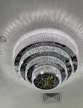 https://cdn.shopify.com/s/files/1/0736/8795/7790/files/oversized-modern-creative-flush-mount-round-multi-layers-crystal-pendant-chandelier-for-livingdining-roomhallway-merlin-lamps-8.webp?v=1765402426